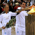 London receives flame in rainy Athens