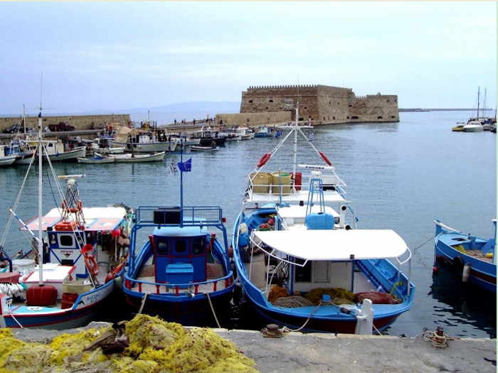 Iraklion harbour. Heraklion is Crete's biggest town. Its impressive Castle, the Venetian port and the fish taverns along the waterfront, have really put the town on the map.