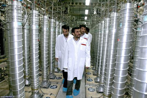 Iranian President Mahmoud Ahmadinejad, center, visits the Natanz Uranium Enrichment Facility some 200 miles (322 kilometers) south of the capital Tehran, Iran. [Xinhua] 
