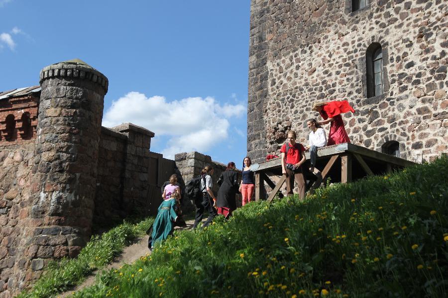 Tourists visit the old castle of Vyborg City in northwestern Russia May 26, 2012. (Xinhua/Lu Jinbo) 