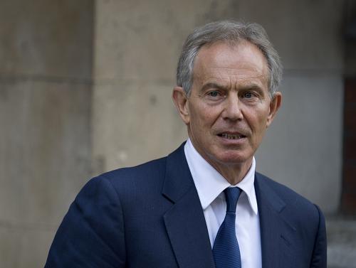 Former British prime minister Tony Blair leaves after giving evidence at the Leveson Inquiry into media ethics at the High Court in central London on May 28, 2012. [Xinhua]