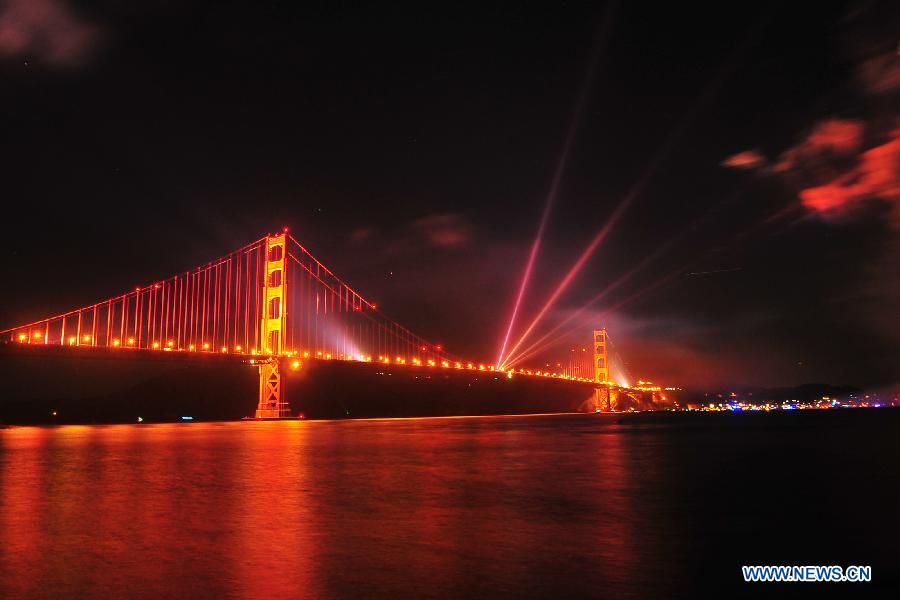 The Golden Gate Bridge is illuminated during its 75th anniversary celebration, San Francisco, the United States, May 27, 2012. Tens of thousand of people came to mark the 75th anniversary of the Golden Gate Bridge, which was opened in 1937. (Xinhua/Liu Yilin)