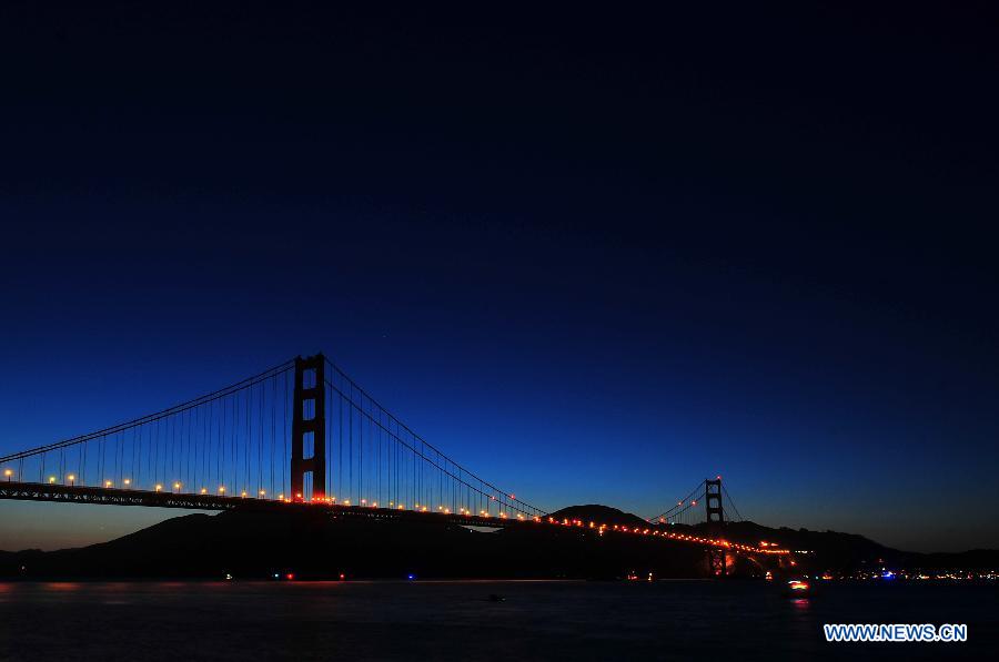 The Golden Gate Bridge is illuminated during its 75th anniversary celebration, San Francisco, the United States, May 27, 2012. Tens of thousand of people came to mark the 75th anniversary of the Golden Gate Bridge, which was opened in 1937. (Xinhua/Liu Yilin) 