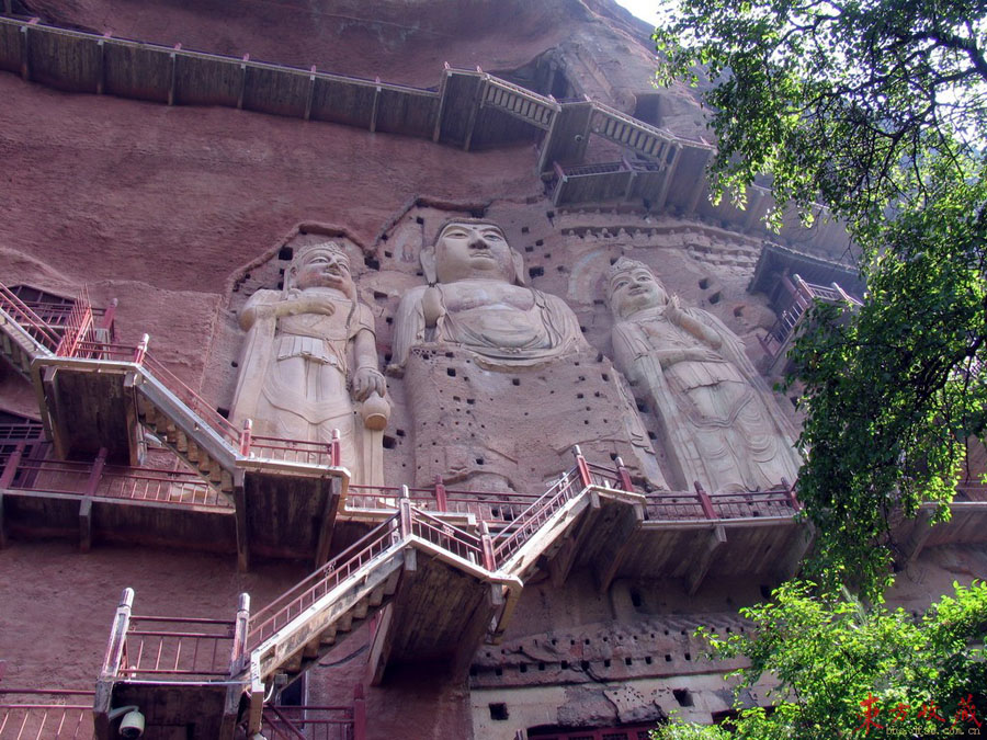 These grottoes (麦积山石窟) are found on the precipices of Maiji Mountain 30 kilometers south of Tianshui County, Gansu Province. Maiji Mountain is a green and graceful peak in the western part of the grand Qinling Range. The grottoes were cut during a period of 1,500 years, from the Later Qin Dynasty (384-417) until the Qing Dynasty (1644-1911). 