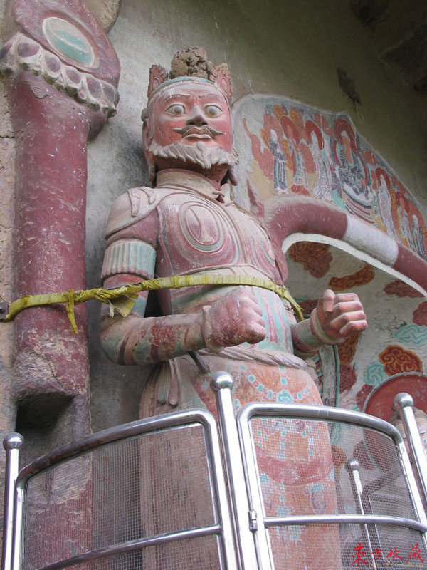 These grottoes (麦积山石窟) are found on the precipices of Maiji Mountain 30 kilometers south of Tianshui County, Gansu Province. Maiji Mountain is a green and graceful peak in the western part of the grand Qinling Range. The grottoes were cut during a period of 1,500 years, from the Later Qin Dynasty (384-417) until the Qing Dynasty (1644-1911). 