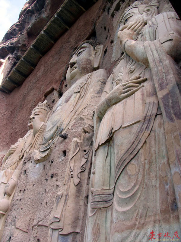 These grottoes (麦积山石窟) are found on the precipices of Maiji Mountain 30 kilometers south of Tianshui County, Gansu Province. Maiji Mountain is a green and graceful peak in the western part of the grand Qinling Range. The grottoes were cut during a period of 1,500 years, from the Later Qin Dynasty (384-417) until the Qing Dynasty (1644-1911). 