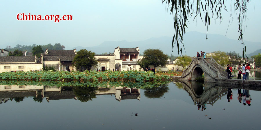 Hongcun Village is located in Yixian County at the foot of the southwestern slope of Huangshan Mountain, Anhui Province. With morning mist, stone bridges, white walls, water lily ponds and hills, it has been described as a village out of a traditional Chinese ink painting.