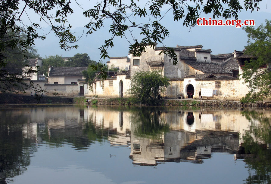 Hongcun Village is located in Yixian County at the foot of the southwestern slope of Huangshan Mountain, Anhui Province. With morning mist, stone bridges, white walls, water lily ponds and hills, it has been described as a village out of a traditional Chinese ink painting.