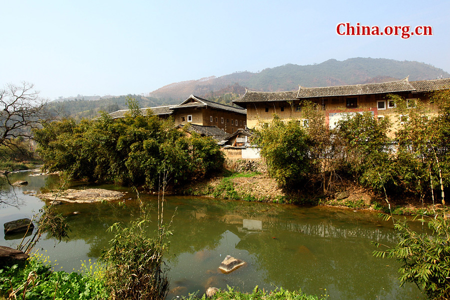 Built on a base of stone, the thick walls of Tulou were packed with dirt and fortified with wood or bamboo internally. The architectural arts of the Fujian Tulou can be traced back nearly 1,000 years, and their design incorporates the tradition of fengshui (favorable siting within the environment).