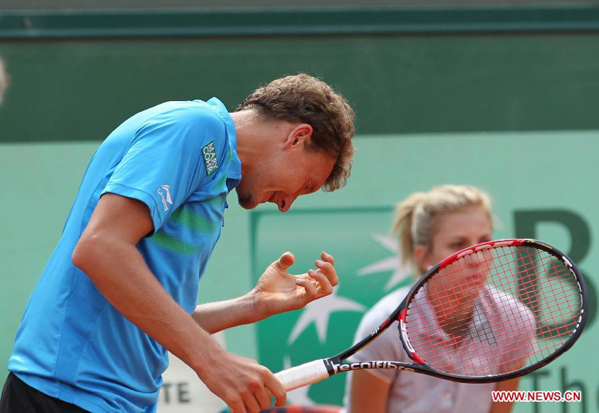 Denis Istomin of Uzbekistan reacts during the men's singles second round match against Rafael Nadal of Spain at the French Open tennis tournament in Paris, May 31, 2012. Nadal won 3-0.