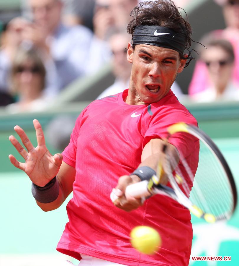 Rafael Nadal of Spain returns the ball during the men's singles second round match against Denis Istomin of Uzbekistan at the French Open tennis tournament in Paris, May 31, 2012. Nadal won 3-0.