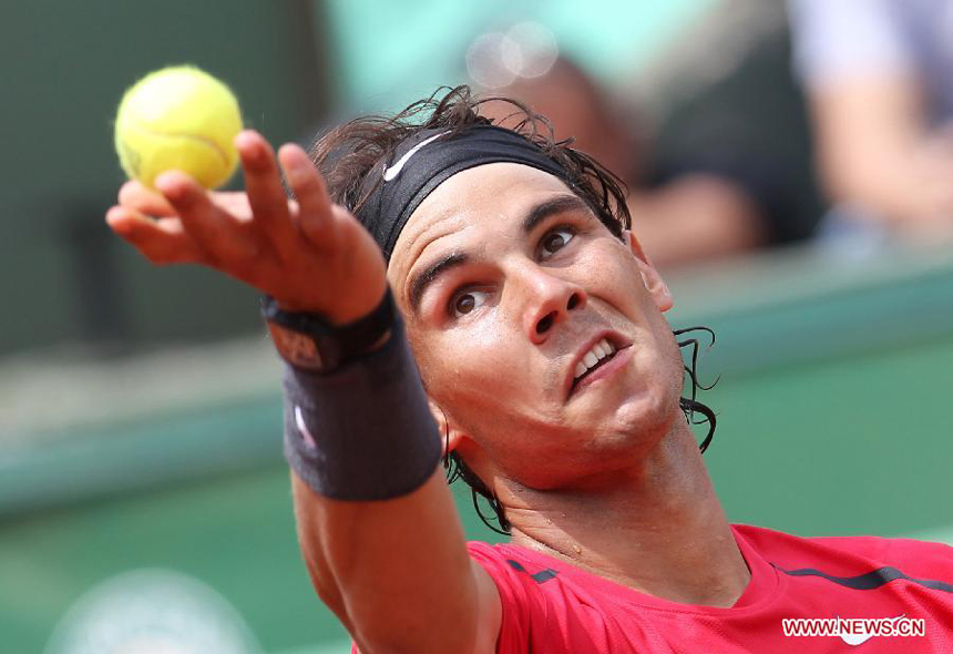 Rafael Nadal of Spain serves the ball during the men's singles second round match against Denis Istomin of Uzbekistan at the French Open tennis tournament in Paris, May 31, 2012. Nadal won 3-0.