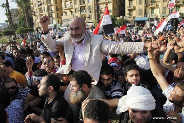 Protestors hold a demonstration after a court sentenced deposed president Hosni Mubarak to life in prison, at the Tahrir Square in Cairo, capital of Egypt, June 2, 2012. [Xinhua] 