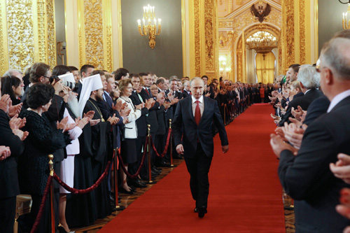 Vladimir Putin walks in the Kremlin in Moscow on May 7 as he goes to take his oath of office [Xinhua/AFP] 