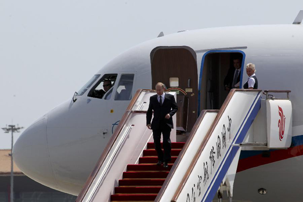 Russian President Vladimir Putin gets off a plane after arriving in Beijing, capital of China, June 5, 2012, kicking off a three-day state visit to China. [Ding Lin/Xinhua]