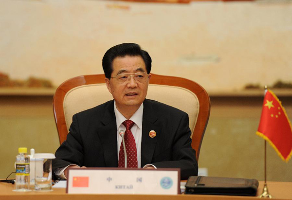 Chinese President Hu Jintao presides over a small-group meeting of the 12th Meeting of the Council of Heads of Member States of the Shanghai Cooperation Organization (SCO) in Beijing, capital of China, June 6, 2012. [Pang Xinglei/Xinhua]