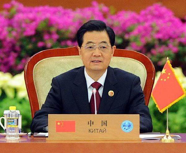 Chinese President Hu Jintao presides over the large group meeting of the 12th Meeting of the Council of Heads of Member States of the Shanghai Cooperation Organization (SCO) at the Great Hall of the People in downtown Beijing, capital of China, June 7, 2012. President Hu delivered a key-note speech during the meeting. [Li Tao/Xinhua] 