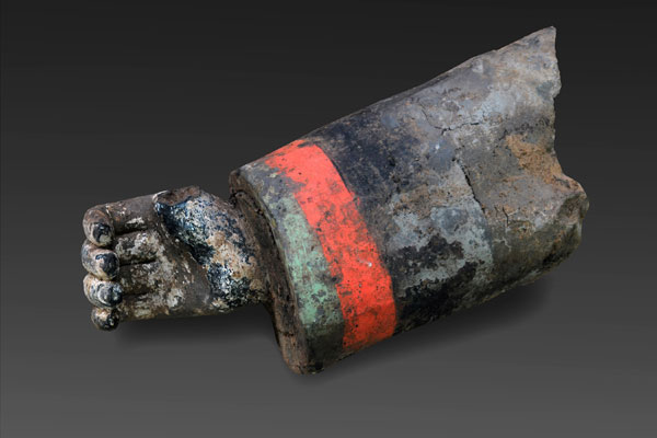 The forearm and hand of a colored terracotta warrior 