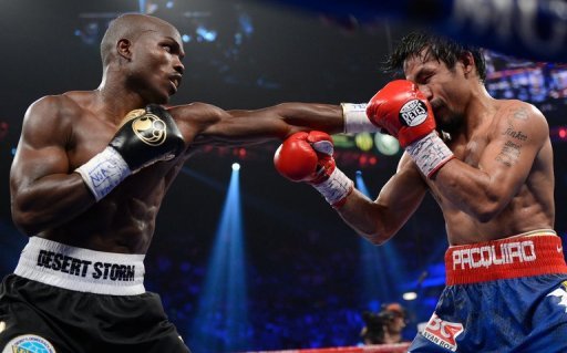 Timothy Bradley (L) lands a punch to the face of Manny Pacquiao during their WBO welterweight title fight at MGM Grand Garden Arena on June 9. 