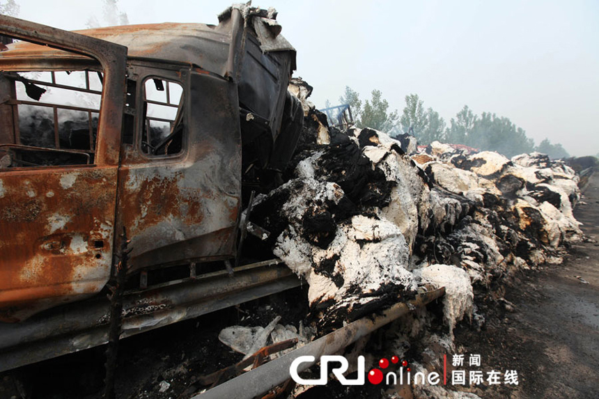 Photo taken on June 10, 2012 shows the spot of rear-end collisions at the Mengcheng section of the Nanjing-Luoyang Expressway near Bozhou, east China's Anhui Province. Eleven people were killed and another 59 injured in several rear-end collisions on the section of expressway on Saturday night, rescuers said Sunday