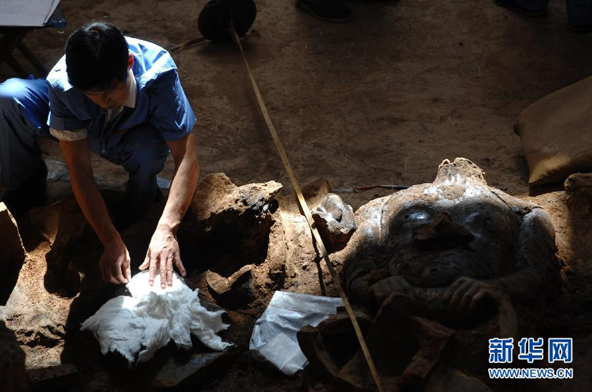 Terracotta warriors are unearthed in the excavation pit at the mausoleum of China's First Qin Emperor on Saturday, June 9, 2012 in Shaanxi province. Archaeologists said they found the warriors were once deliberately set afire in ancient times. 