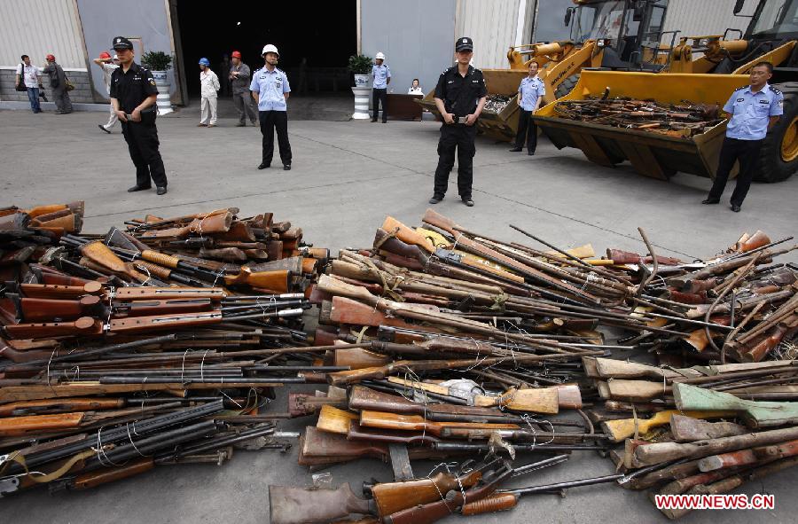 Police destroy illegal arms across China