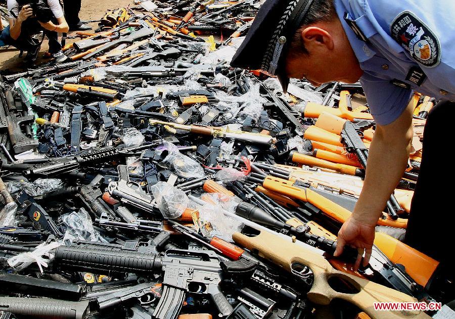 Police destroy illegal arms across China