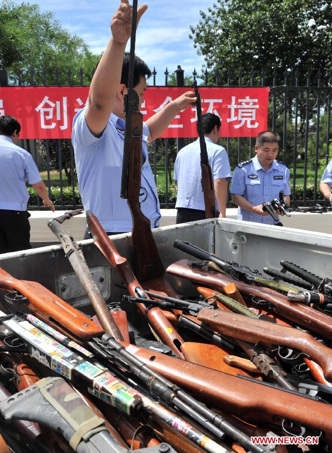 Police destroy illegal arms across China