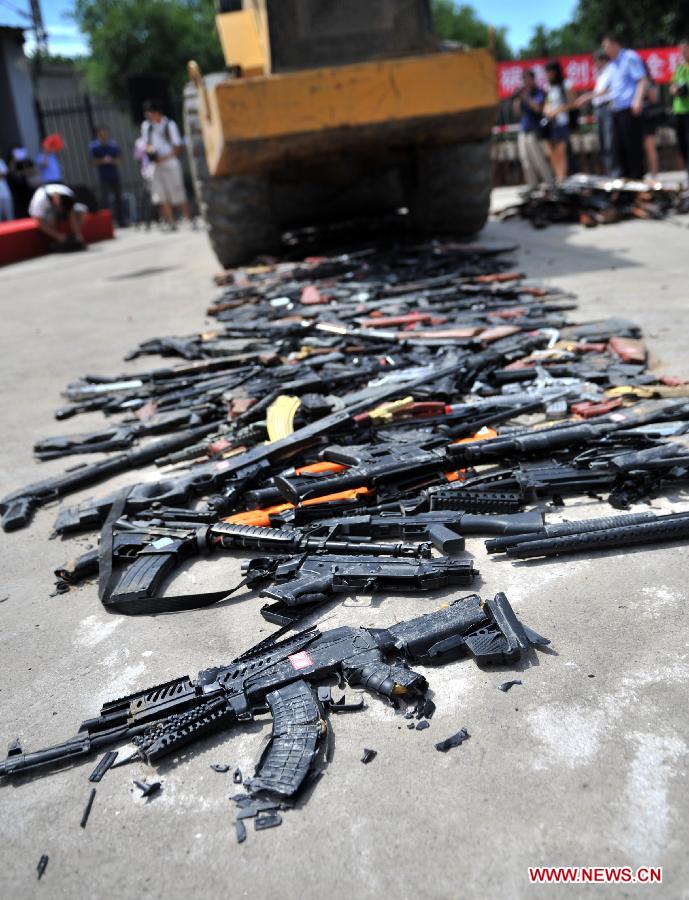 Police destroy illegal arms across China