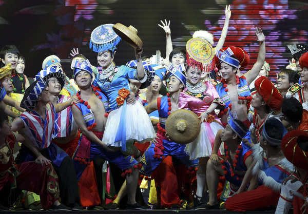Artists perform at an opening ceremony for the fourth Minorities Art Festival of China at the Beijing National Stadium, June 12. More than 6,700 ethnic performers will participate in the festival, which will last from June 7 to July 6. [ Photo / Xinhua ]