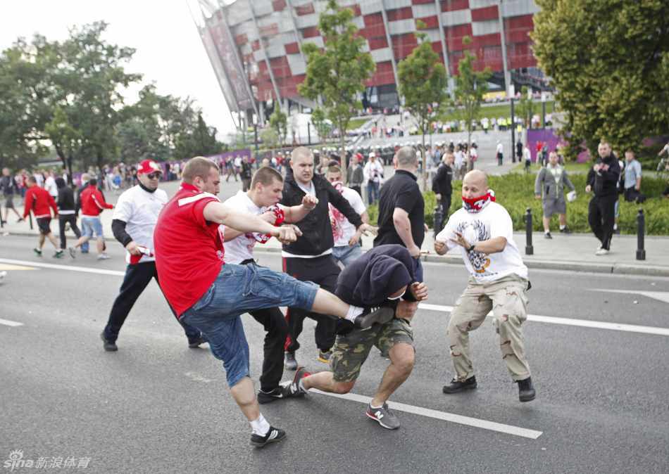 Polish fans clash with their Russian counterparts outside the National Stadium 