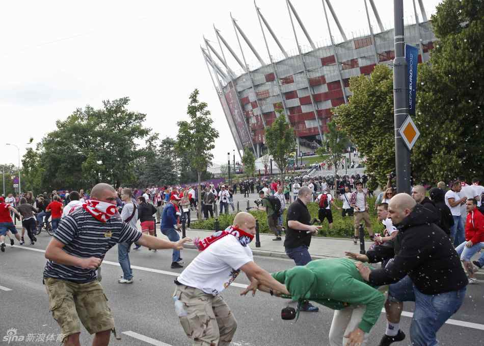 Polish fans clash with their Russian counterparts outside the National Stadium. 