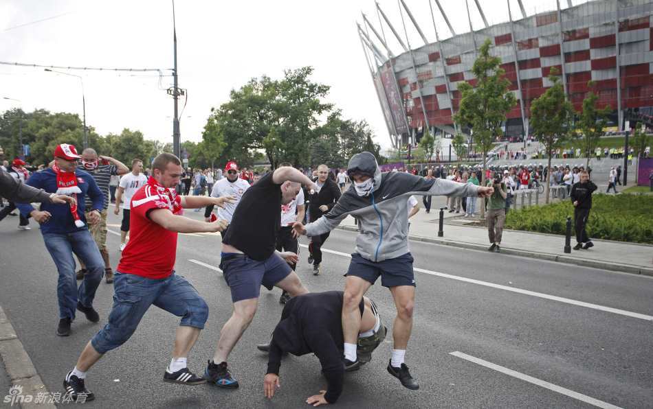 Polish fans clash with their Russian counterparts outside the National Stadium. 