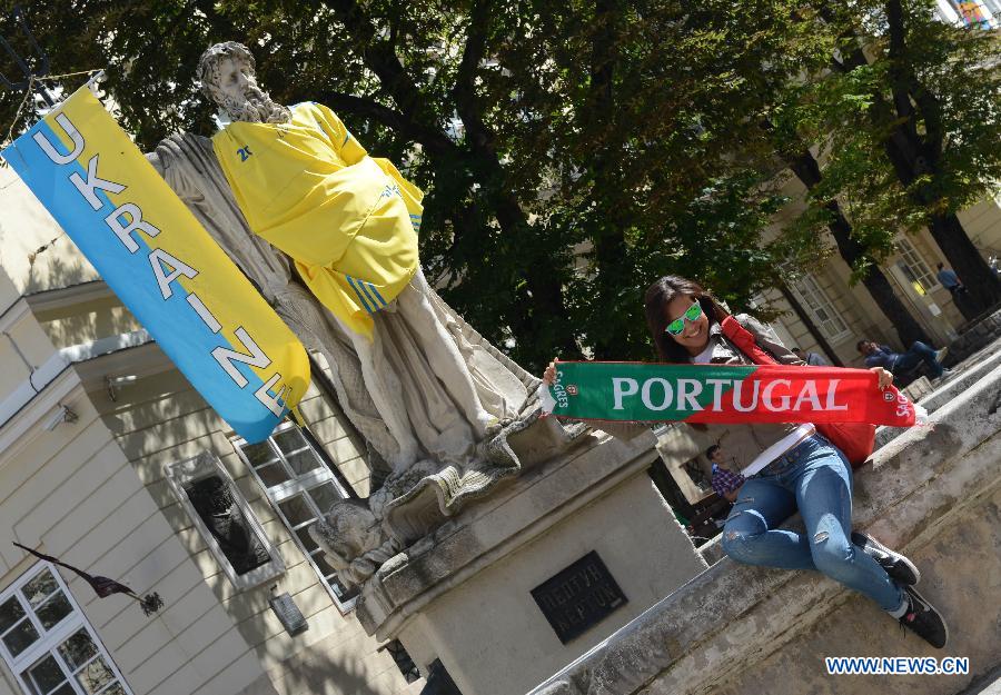 A fan of Portugal poses for a photo in Lviv, Ukraine, which is the host city for matches of Euro 2012 football championships Group B. (Xinhua/Ma Ning)