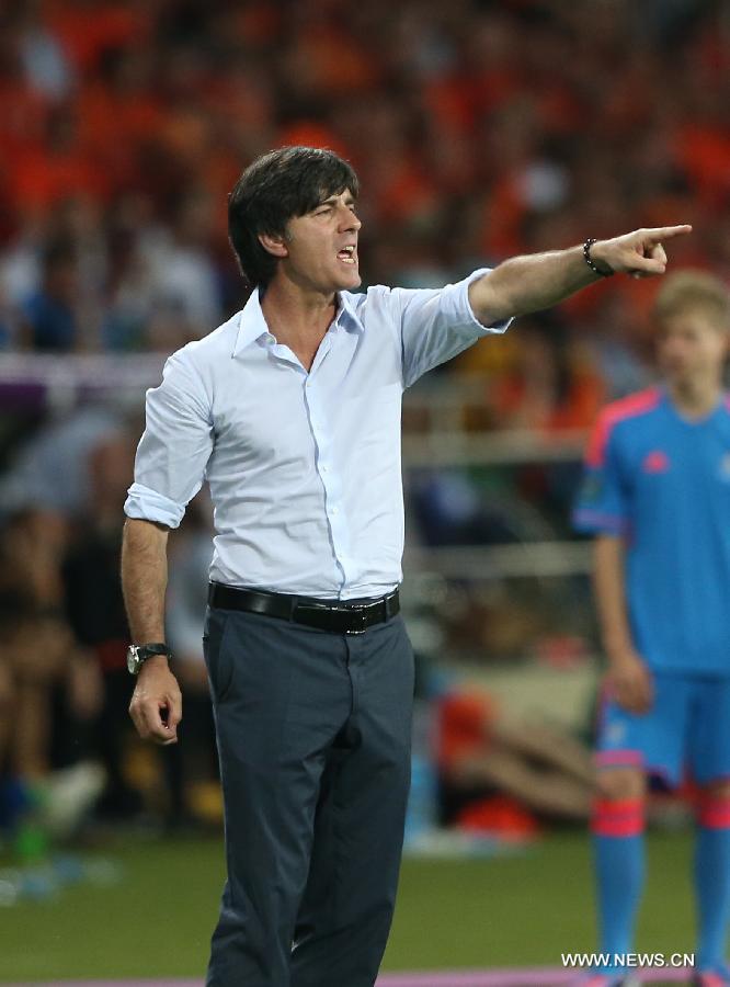 Germany's head coach Joachim Loew reacts during the Group B 2nd round match against Netherlands at the Euro 2012 football championships in Kharkiv, Ukraine, June 13, 2012. Germany won 2-1. (Xinhua/Meng Yongmin) 