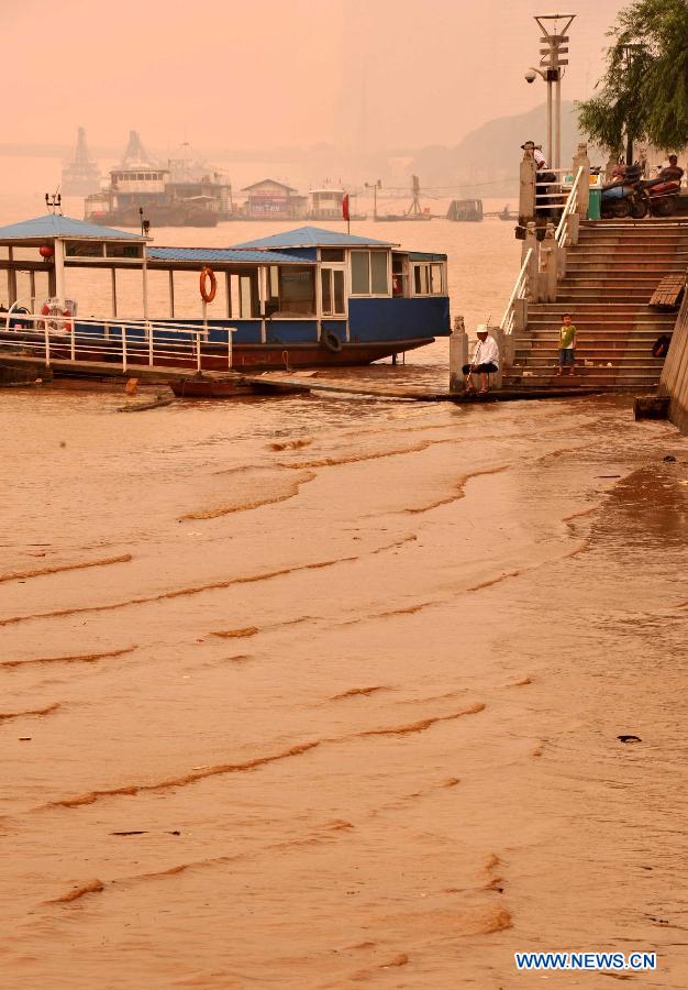 Water tourism platform is submerged by yellow water in Changsha, capital of central China's Hunan Province, June 14, 2012.The flood peak of Xiangjiang River passed through Changsha on Wednesday. (Xinhua/Zhao Zhongzhi) 