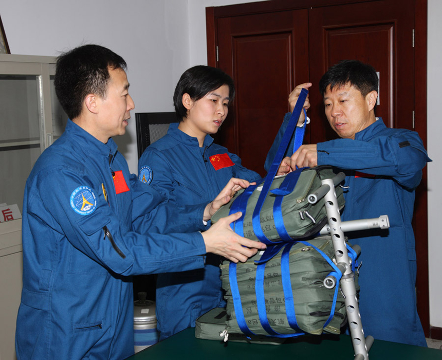 Three astronauts, two male and one female, will board Shenzhou 9 spacecraft to fulfill China's first manned space docking mission. They are Jing Haipeng, Liu Wang and Liu Yang who is female, according to a decision made by China's manned space docking program headquarters. 