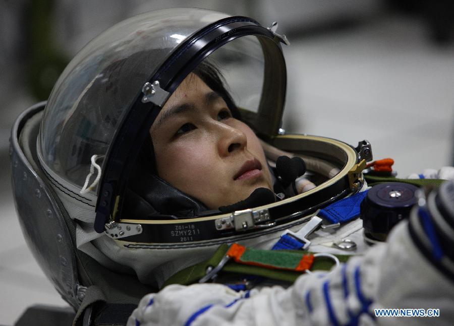 (This undated photo shows Liu Yang attending a training. Liu Yang, 34, is one of the three taikonauts who will be carried by the Shenzhou-9 spaceship for China's first manned space docking mission with the orbiting Tiangong-1 space lab module. 