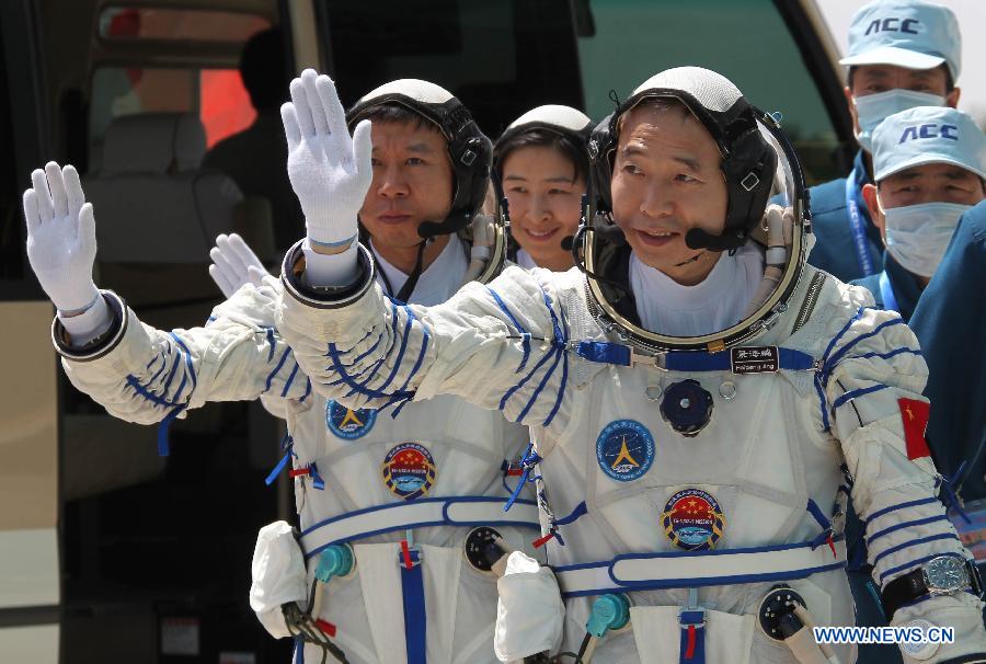 Three taikonauts Jing Haipeng, Liu Wang and Liu Yang (Front to Rear) attend a joint drill in Jiuquan, northwest China's Gansu Province, on June 12, 2012. They will be carried by the Shenzhou-9 spaceship for China's first manned space docking mission with the orbiting Tiangong-1 space lab module