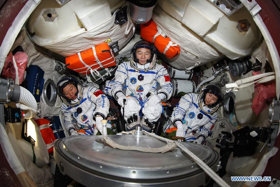 This undated photo shows Liu Yang attending a training. Liu Yang, 34, is one of the three taikonauts who will be carried by the Shenzhou-9 spaceship for China's first manned space docking mission with the orbiting Tiangong-1 space lab module. 