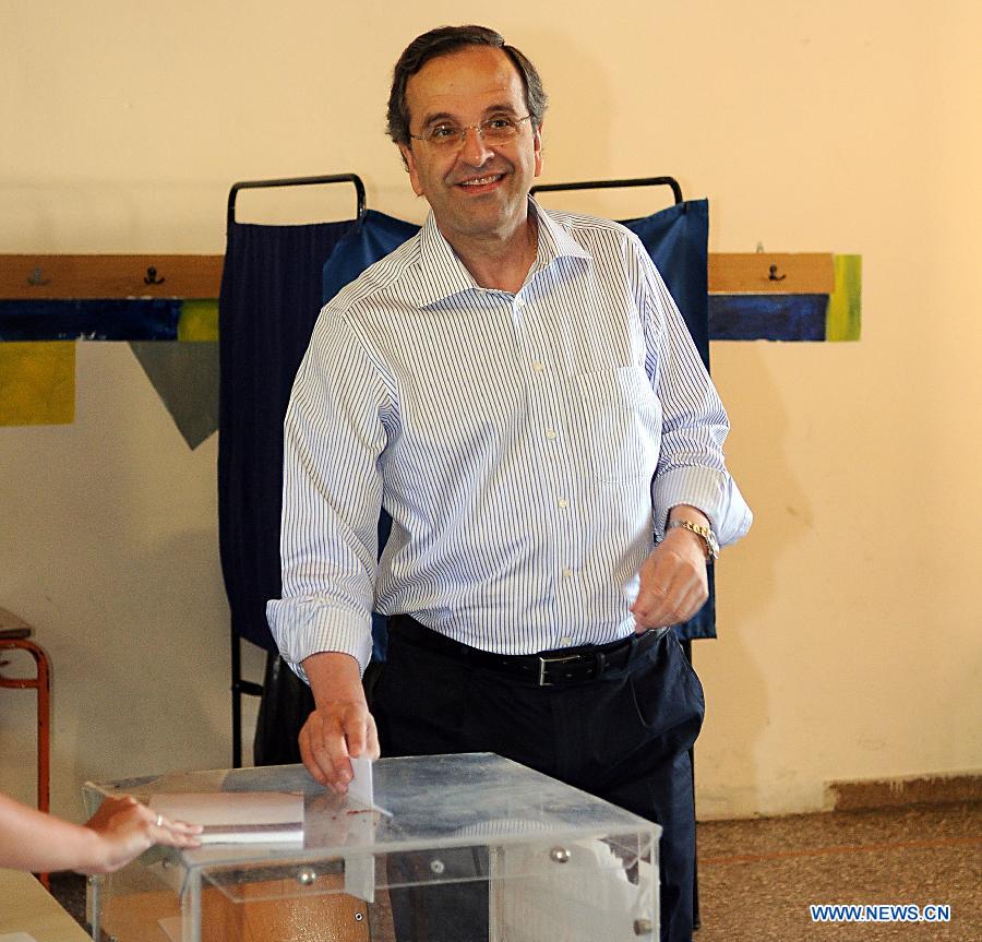 Antonis Samaras, president of the conservative party New Democracy, casts his vote in the town of Pylos, southern Greece, June 17, 2012. Greek political leaders cast their ballots on Sunday in crucial general elections and expressed optimism over the results of the polls that could determine Greece's economic future and membership in the European single currency zone.