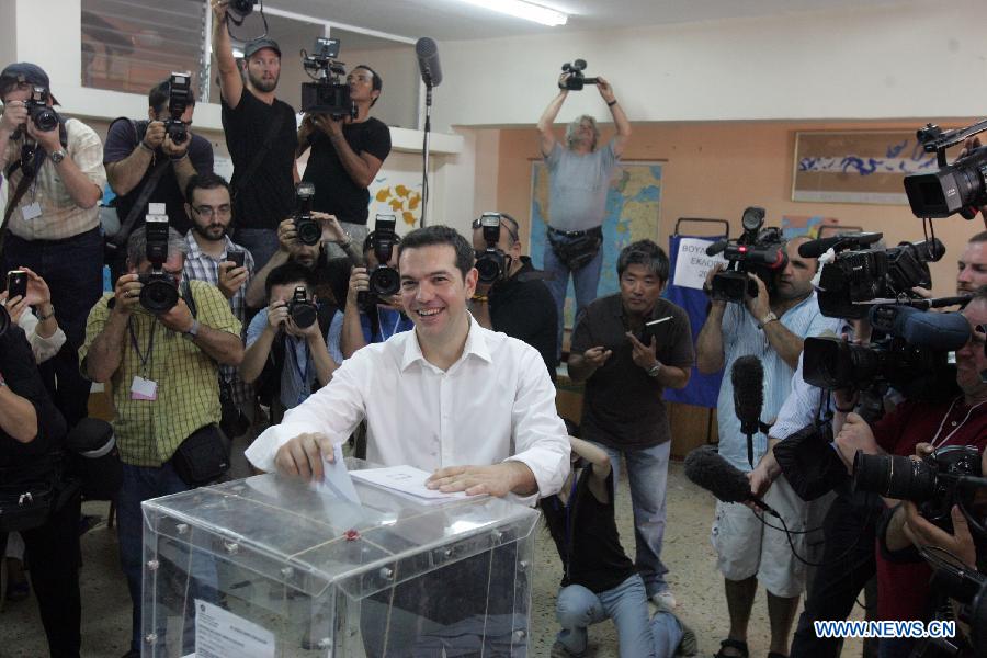 Alexis Tsipras, leader of the Radical Left Coalition SYRIZA, casts his vote in Kypseli area, central Athens, Greece, June 17, 2012. Greek political leaders cast their ballots on Sunday in crucial general elections and expressed optimism over the results of the polls that could determine Greece's economic future and membership in the European single currency zone. 