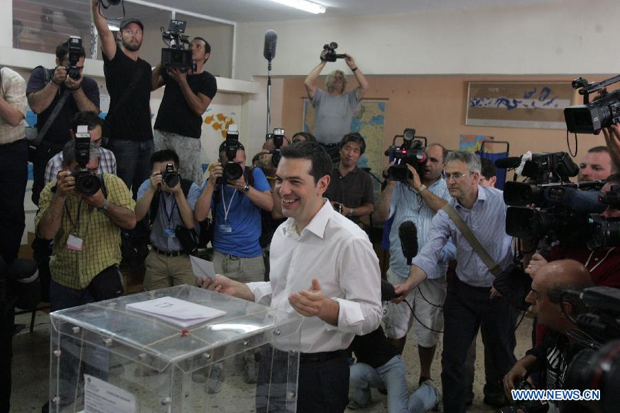 Alexis Tsipras, leader of the Radical Left Coalition SYRIZA, casts his vote in Kypseli area, central Athens, Greece, June 17, 2012. Greek political leaders cast their ballots on Sunday in crucial general elections and expressed optimism over the results of the polls that could determine Greece's economic future and membership in the European single currency zone. 