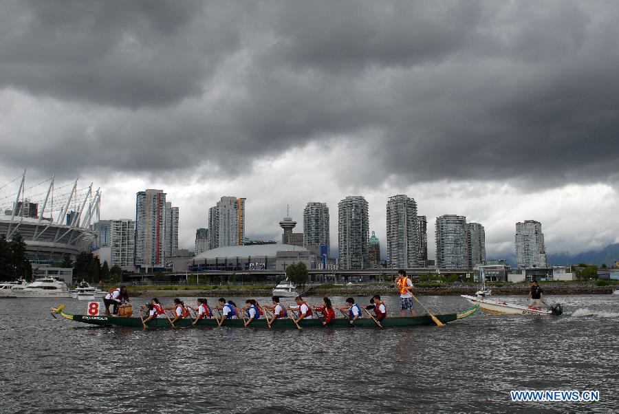 Rowers participate in the 24th Annual Rio Tinto Alcan Dragon Boat Festival and Race at False Creek in Vancouver, Canada, June 17, 2012. 