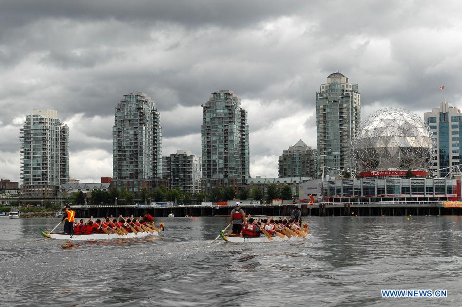 Rowers participate in the 24th Annual Rio Tinto Alcan Dragon Boat Festival and Race at False Creek in Vancouver, Canada, June 17, 2012. 