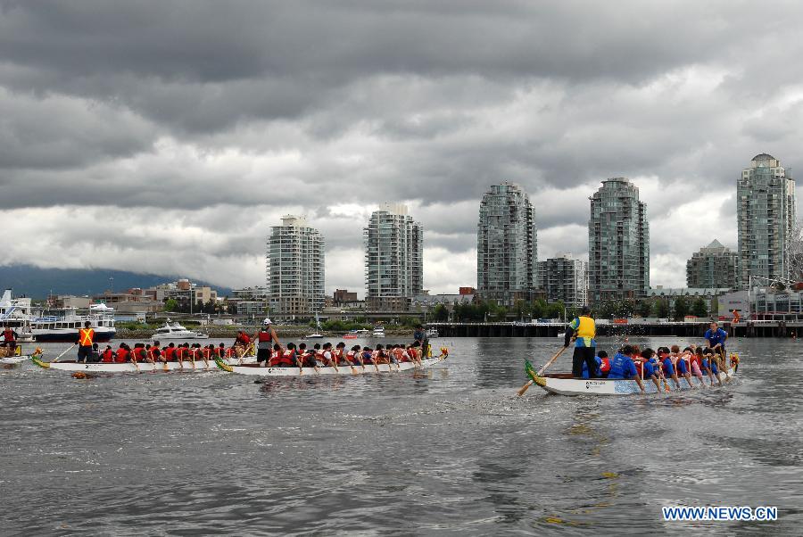 Rowers participate in the 24th Annual Rio Tinto Alcan Dragon Boat Festival and Race at False Creek in Vancouver, Canada, June 17, 2012. 