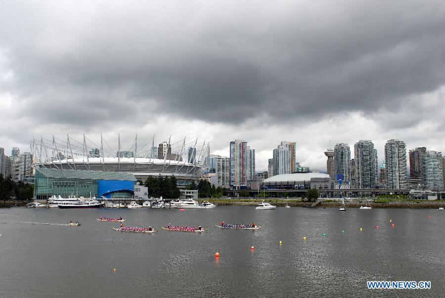 Rowers participate in the 24th Annual Rio Tinto Alcan Dragon Boat Festival and Race at False Creek in Vancouver, Canada, June 17, 2012. 