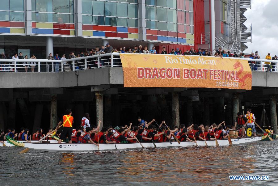 Rowers participate in the 24th Annual Rio Tinto Alcan Dragon Boat Festival and Race at False Creek in Vancouver, Canada, June 17, 2012. 