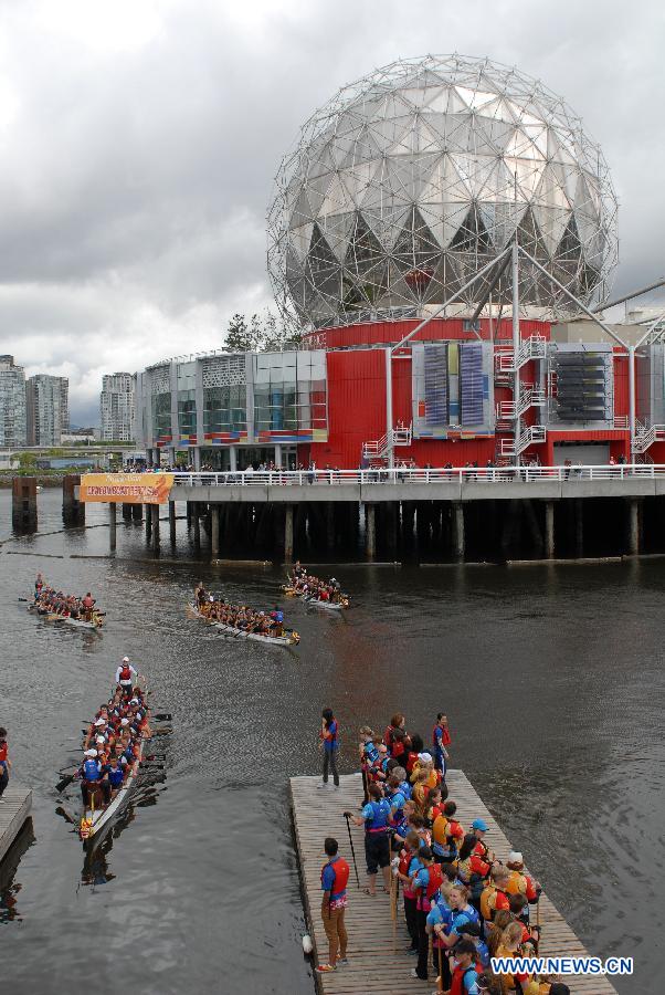 Rowers participate in the 24th Annual Rio Tinto Alcan Dragon Boat Festival and Race at False Creek in Vancouver, Canada, June 17, 2012.