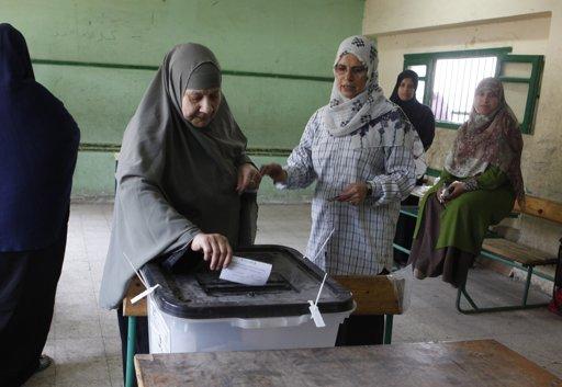 A woman casts her vote during the second day of voting in Egypt's presidential election at a polling station in Cairo June 17, 2012.